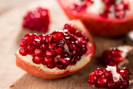 Pomegranate on wooden backgroundの写真素材