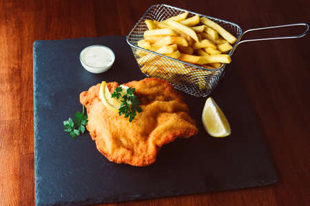 Wiener schnitzel with fried potatoesの写真素材