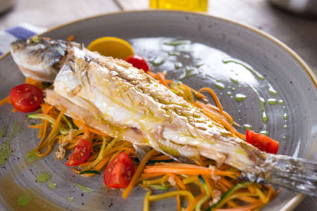 Cooked fish with vegetables