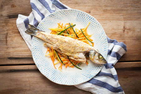 Cooked fish with vegetablesの写真素材
