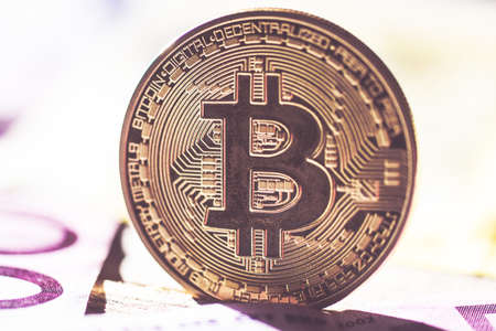 Bitcoins on euro banknotes backgroundの写真素材