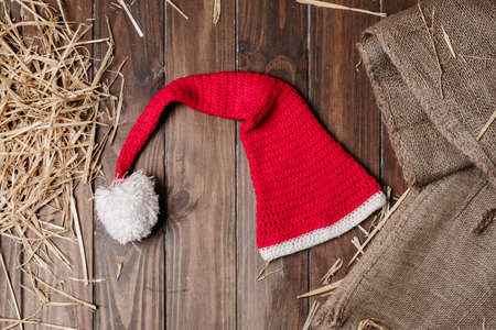 Christmas background of wooden floor with dry straw and Christmas balls