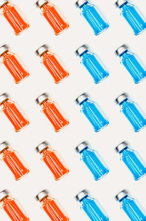 Various medical vials with colored liquid. Medicine health concept of medicine for pandemic or virus.の写真素材