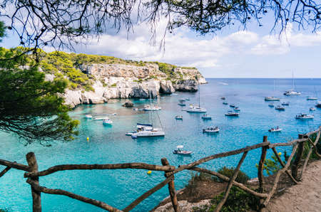 MENORCA, SPAIN. 3 SEPTEMBER 2020. Panoramic view of Cala Macarelleta with people on their boats enjoying a day of vacation.のeditorial素材