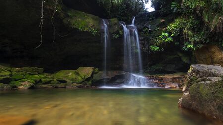 long exposition of waterfall with mossy landscapeの写真素材
