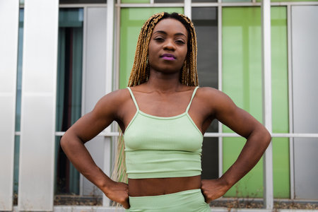 Fit young African American woman looking at camera wearing sports clothes. Healthy lifestyle.の写真素材