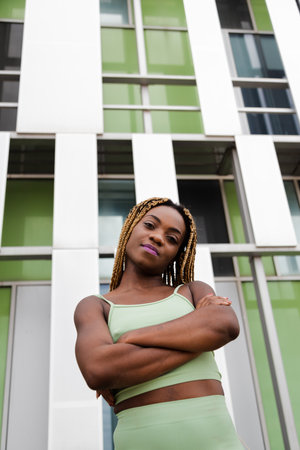 Vertical portrait of African American woman with braided hair looking at camera. Copy space.の写真素材