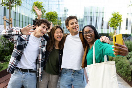 Group of happy multiracial students taking a selfie and waving to the cameraの写真素材