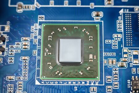 a chip in a computer with many electrical elements, a CPU, a GPU, a microchip in an electronic...