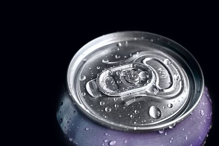 aluminum soda and beer beverage can with water droplets isolated on dark background, metal can,...