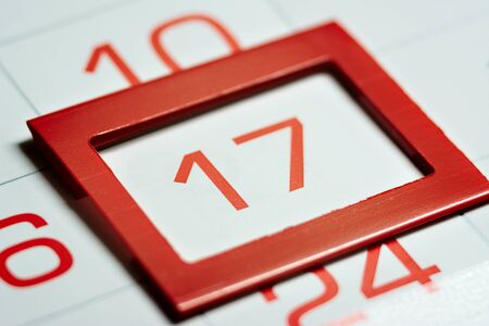 seventeenth of the month highlighted on the calendar with a red frame close-up macro, mark on the calendar, seventeenth dateの写真素材
