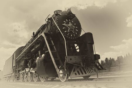 vintage steam train on the rails close-up, retro vehicle, steam engine, black and white photoの写真素材