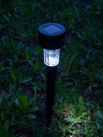 solar powered garden flashlight glows at night, flashlight glows in the dark