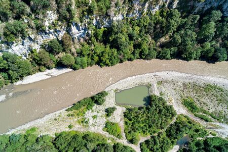 mountain fast bubbling river between the rocks, river flow, top viewの写真素材