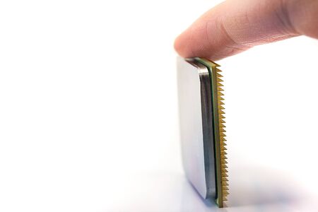 computer CPU in hand close-up isolated on white background