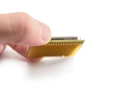 the lower side of modern multi-core multithreaded proceesor with the legs of the contacts, the microconstrictions of the CPU, the central processing unit structure, isolated on white background, selective focusの写真素材