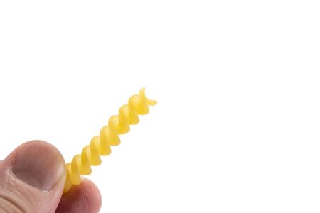 pasta in hand isolated on white background, handmade pasta conceptの写真素材
