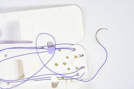 suture material close-up, thread for suturing wounds in medicine, dentistry, medical needle