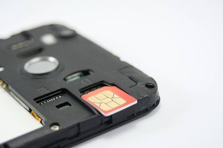 SIM card close-up next to the connector in the smartphone, phone