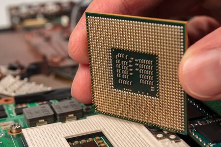 computer CPU close-up on the motherboard background, socket of central process unit, connection of ...