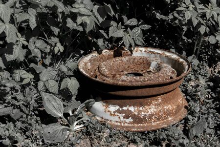 old metal rusty car drive on the side of the roadの写真素材