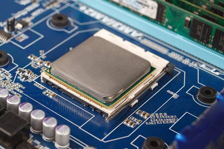 computer CPU close-up on the motherboard background, socket of central process unit, connection of ...