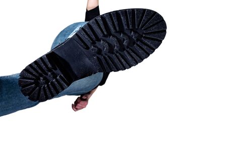 the rough sole of the Shoe, a bottom view, a man coming from the top, crush, isolated on white...