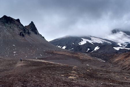 volcanic valley , the volcanic kidney and the sand, the foot of the volcano, fog, clouds