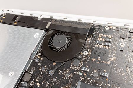 laptop cooling system close-up with rotating fan, CPU cooling and overheating, trottlingの写真素材