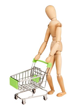 shopping cart in supermarkets with a figure depicting the buyer isolated close-up, macro, shopping concept and purchasing power, consumer basketの写真素材