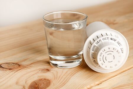 filter for cleaning tap water for drinking and a glass of filtered clean water