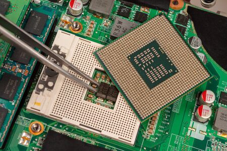 computer CPU close-up on the motherboard background, socket of central process unit, connection of ...