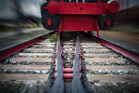 rails for trains close-up selective focus, against the background of the train coming towards, safety on the railway, the danger of railway crossingsの写真素材