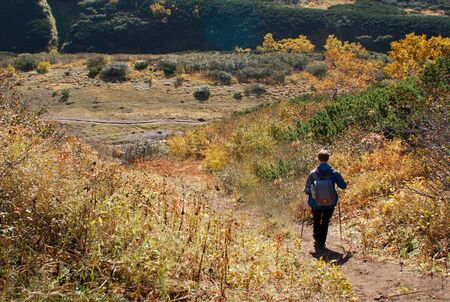 the travelers goes to the mountains, rocks, Hiking