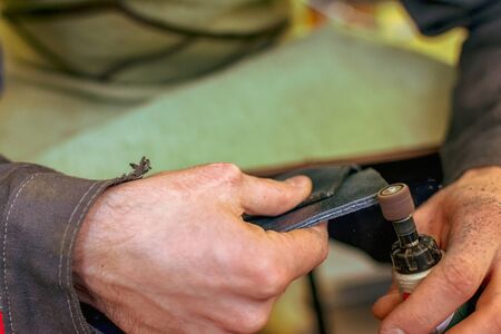 tool for sanding and polishing edges in the hands of a tailor seamstress tanner, polisher for...