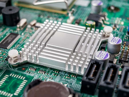 Metal aluminum radiator on the motherboard of a desktop computer, server, printed circuit board,...