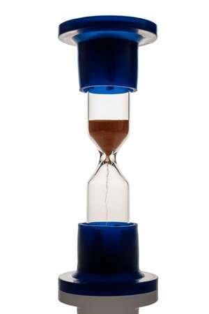 Hourglass with falling sand, isolated on white backgroundの写真素材