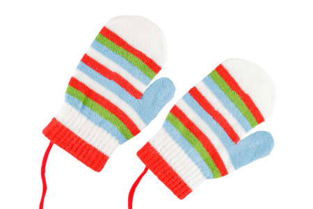 Woolen winter children's mittens, isolated on a white background, close-up, warm clothes for kidsの写真素材