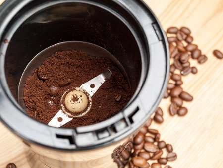 Coffee grinder for grinding roasted coffee beans, electric, close-up, selective focusの写真素材