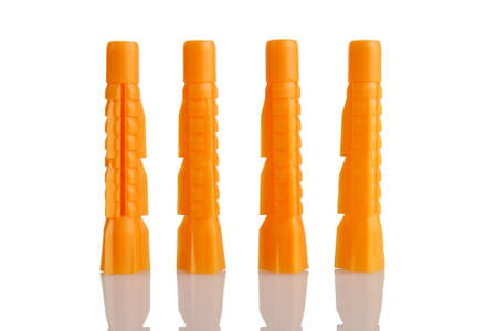 plastic retaining dowels for mounting to the wall close-up, isolated on a white background, for...