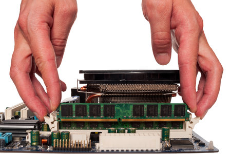 Hand holding RAM modules to assemble a computer, choosing the right components for a computer, types of RAM isolated on a backgroundの写真素材
