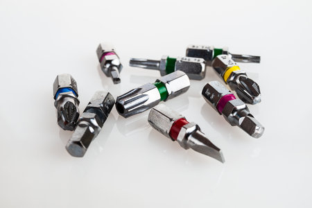 replaceable head bits for screwdrivers, set isolated on white background, close-up