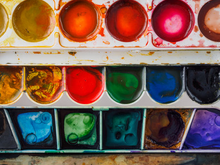 palette with watercolor paints close-up, macro, colorful background of the artist's palette, drawing, study for childrenの写真素材