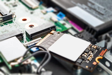 modern ssd drive in a laptop, replacement repair, close-up