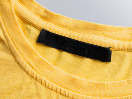 Yellow t-shirt with blank tag closeの写真素材