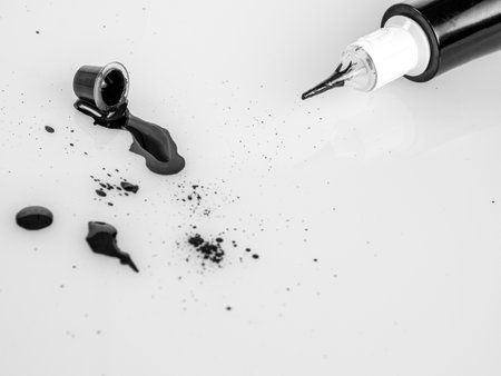 Tattoo machine for tattooing , permanent makeup, with jars of paint, close-up needle, selectiveの写真素材