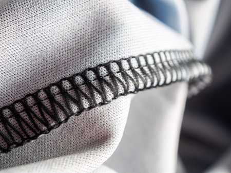 Factory textile fabric material surface white colored background with thread close-upの写真素材