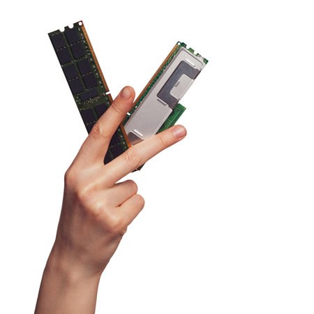 Hand holding RAM modules to assemble a computer, choosing the right components for a computer, types...