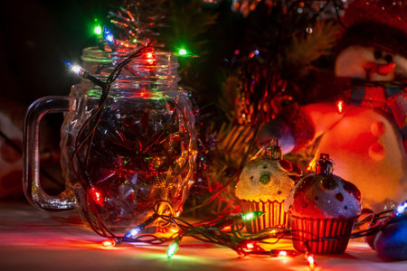 burning garland lights, New Year decorations toys, Christmas preparations at home, selective focus, close-upの写真素材