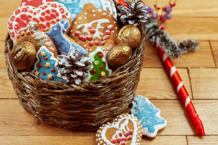 Christmas gingerbread cookies baked and decorated with icing with different pictures in the form of houses and Christmas trees close-up selective focusの写真素材
